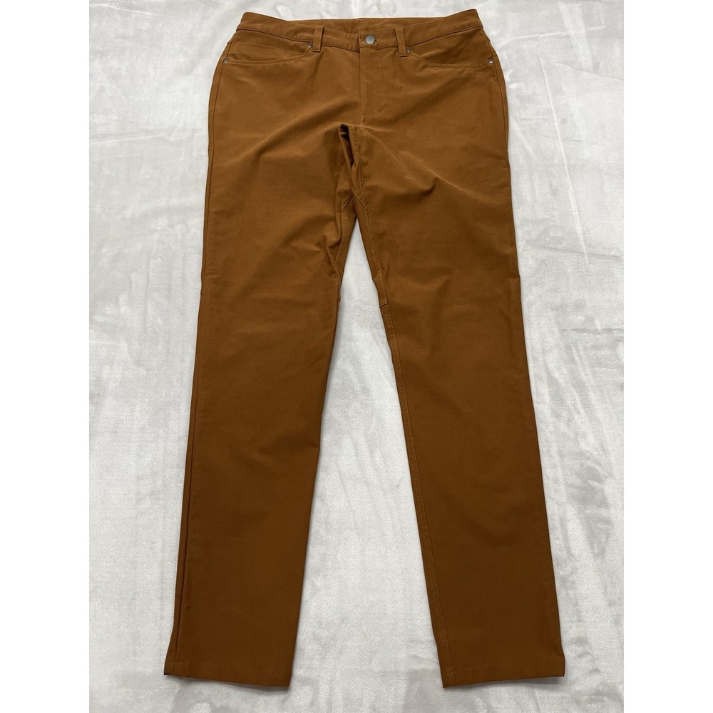 Lululemon ABC Pants Men 33 Mustard Slim Utilitech Fabric Abrasion Resistant Jean